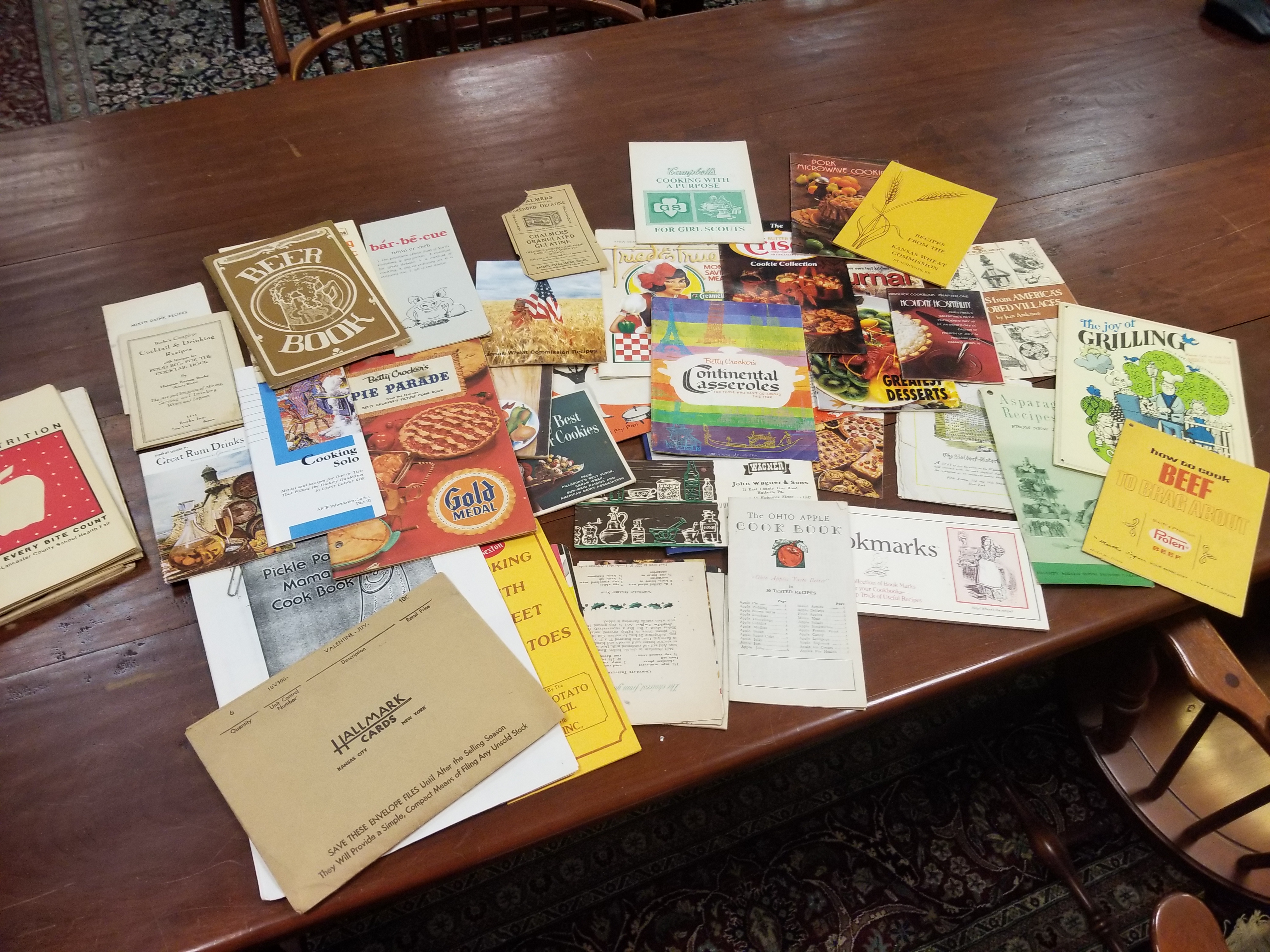 Culinary pamphlets spread out on a wood table